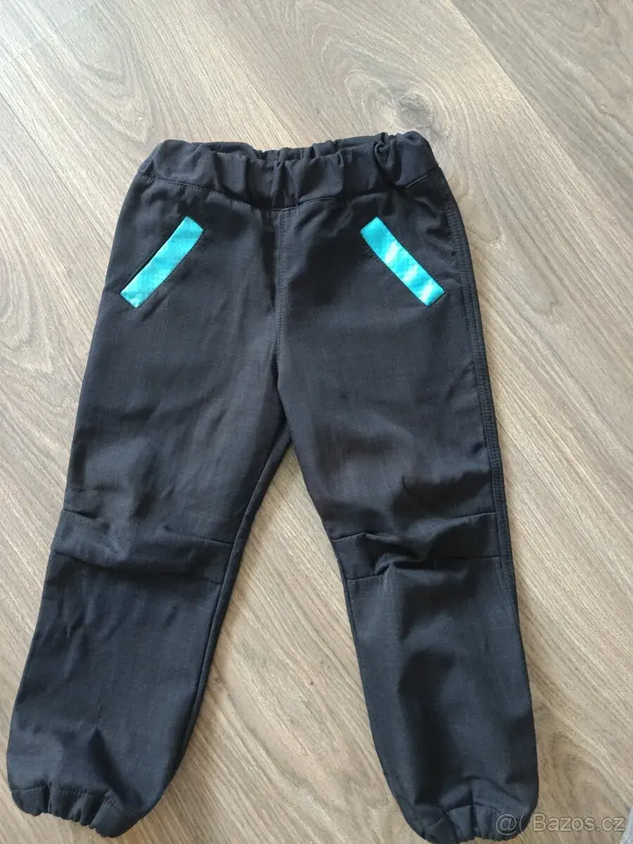 Softshellové kalhoty velikost 104
