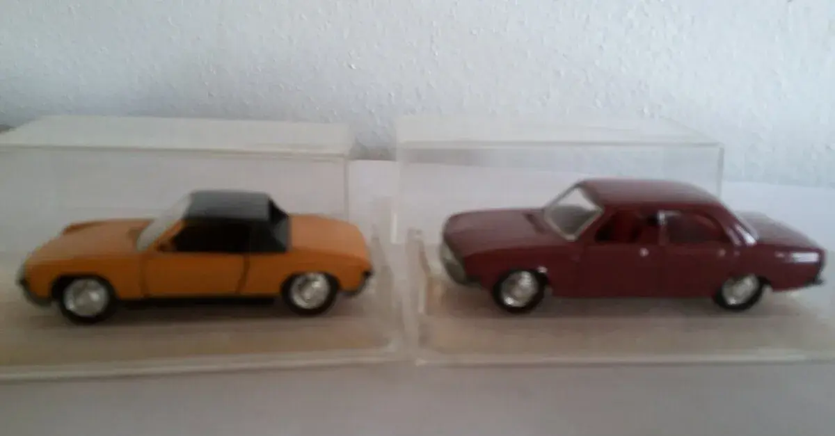 Dva starší modely Schuco 1:66 Audi 100 a Porsche 914 S
