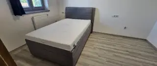 Čalouněná postel 120x200 cm s roštem a matrací