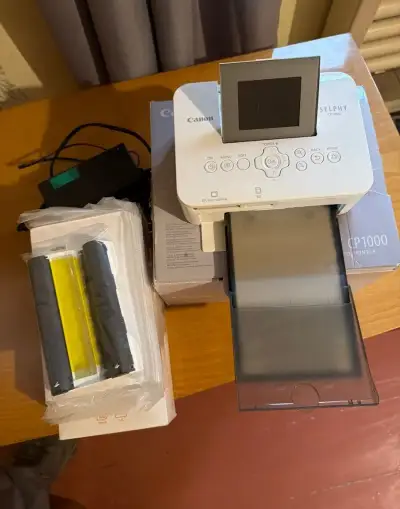Canon SELPHY CP1000 + náplň a spousta fotopapírů