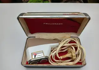 Historický holící strojek Philishave s krabičkou