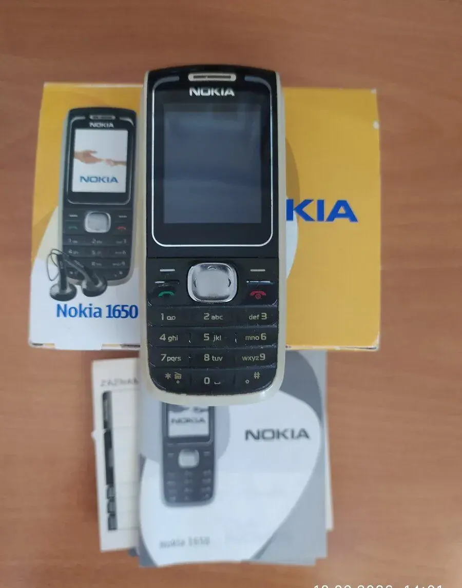 Nokia 1650 s nabíječkou, sluchátky a s návodem