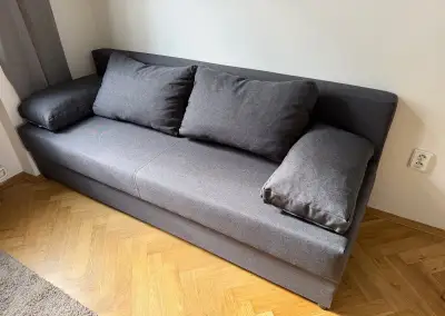 Tmavě šedá rozkládací pohovka